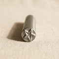Close-up of steel star punch tip showing sharp, precise cutting edge for jewellery making