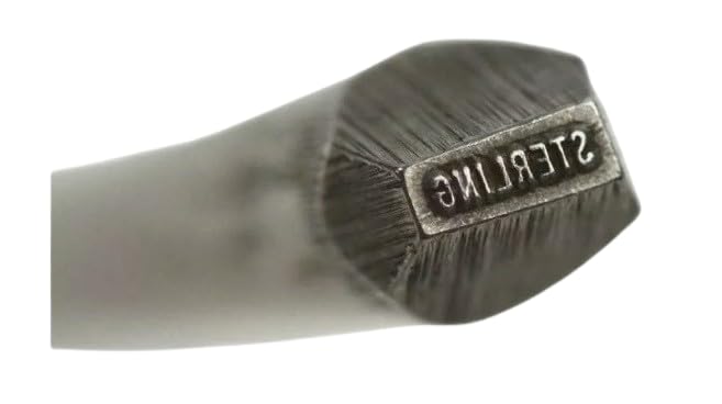 Close-up of the STERLING hallmark stamp punch bar showing its precise engraving for silversmithing.
