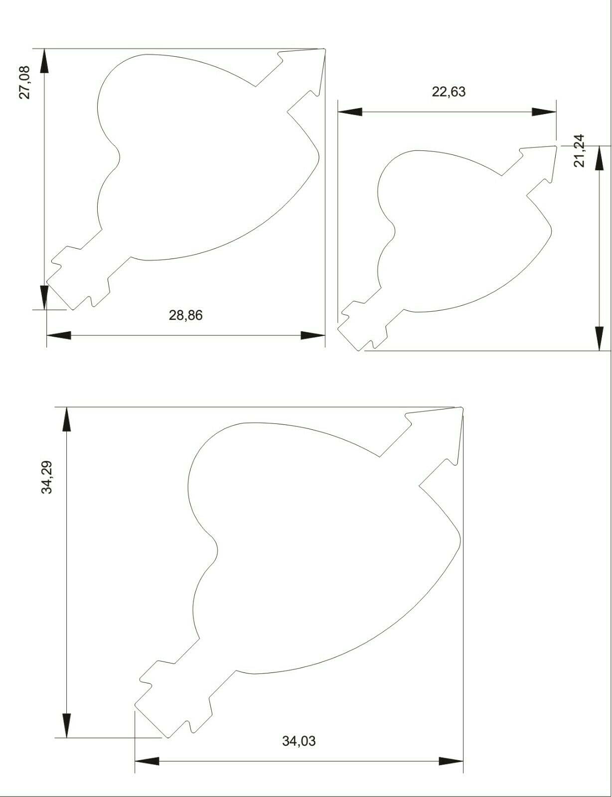Close-up of the three steel heart and arrow punch cutters, showing different disc sizes for metal shaping.