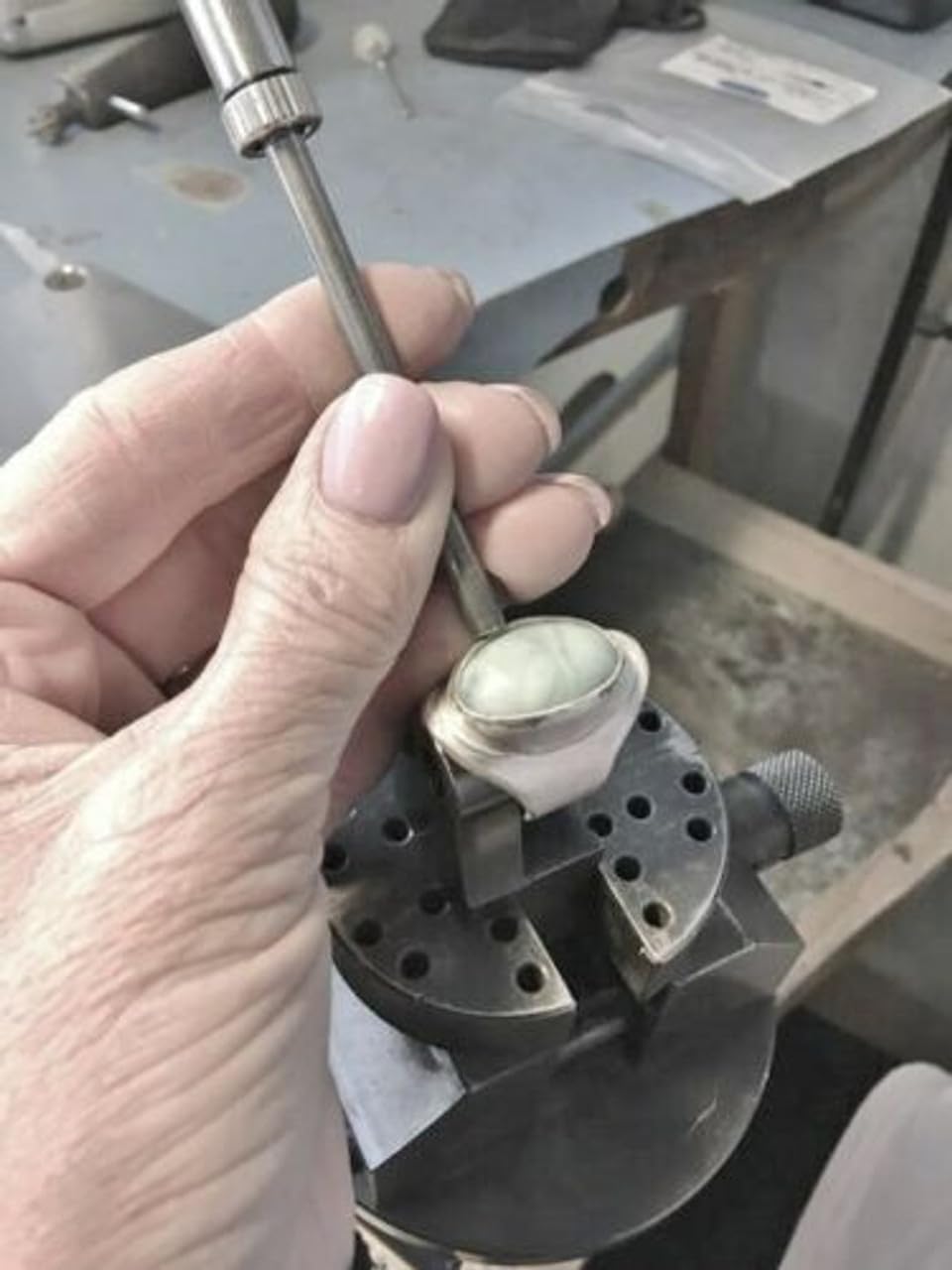 Close-up of sliding hammer head with interchangeable punch for precise jewellery forming