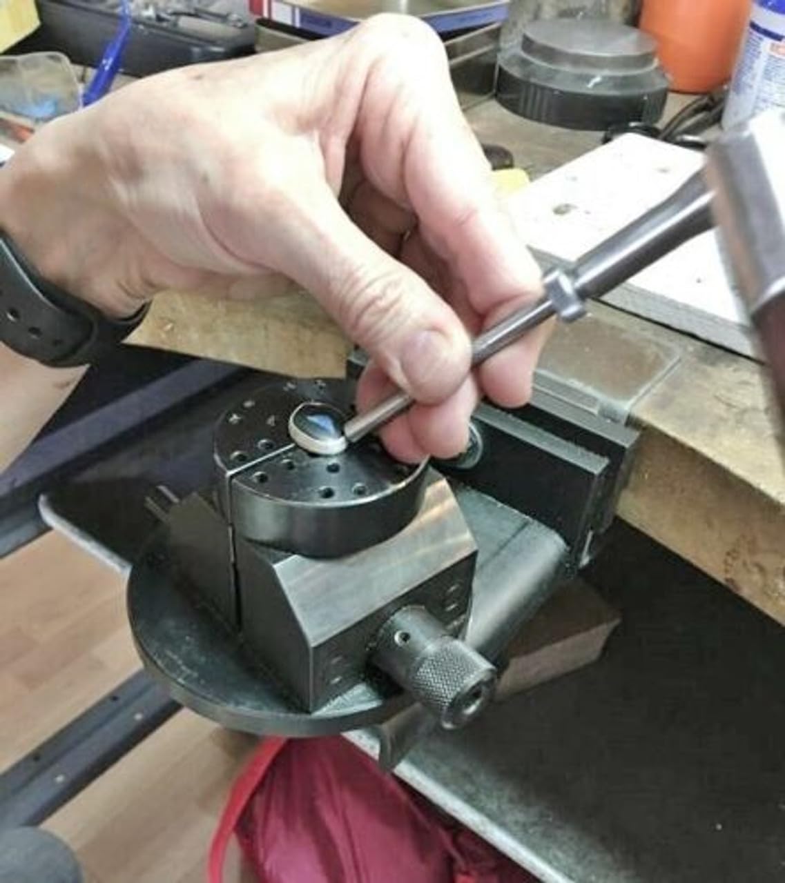 Close-up of sliding hammer head, showing interchangeable punch attachment for detailed jewellery work.