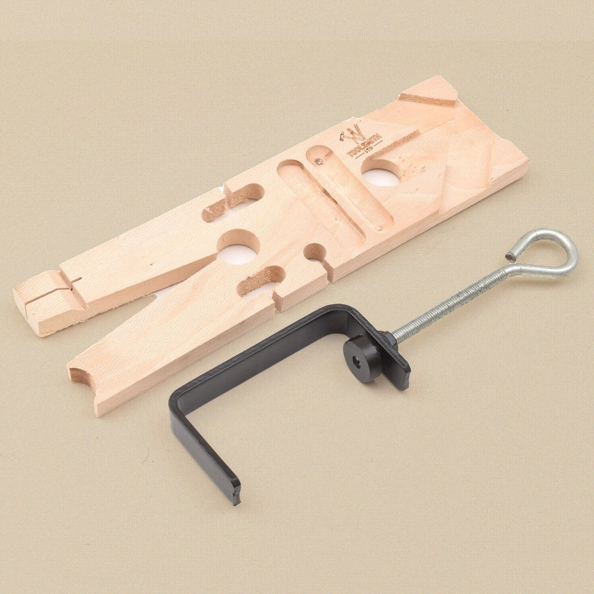 Bench pin and clamp seen from above, showing the cut-outs