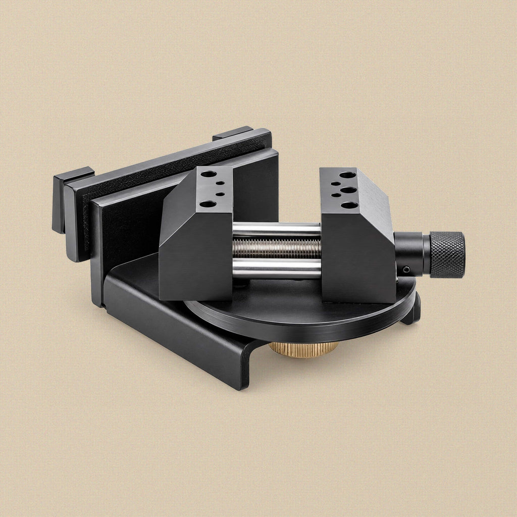 Toolsmith jewellery bench vice in black powder-coated steel with 360° rotating base, mounting rail and knurled jaw screw