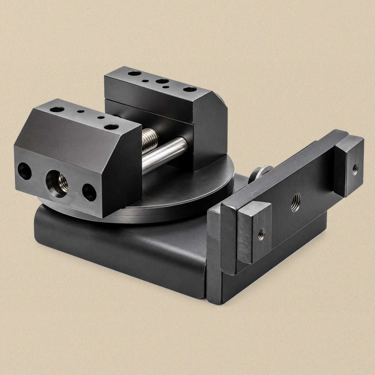 Bench vice turned on its rotating base with the jaws open and the mounting rail to one side