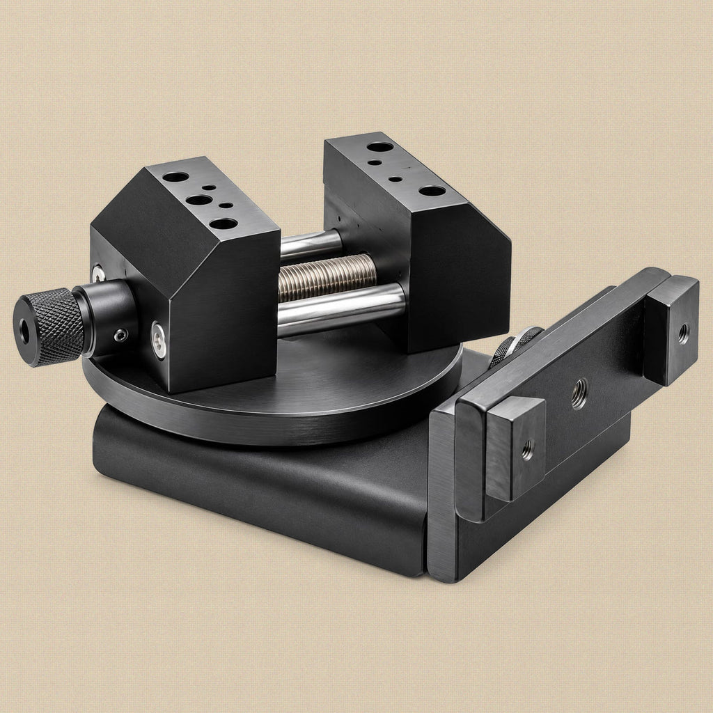 Bench vice from the jaw-screw end, showing the knurled screw, threaded rod and rotating base