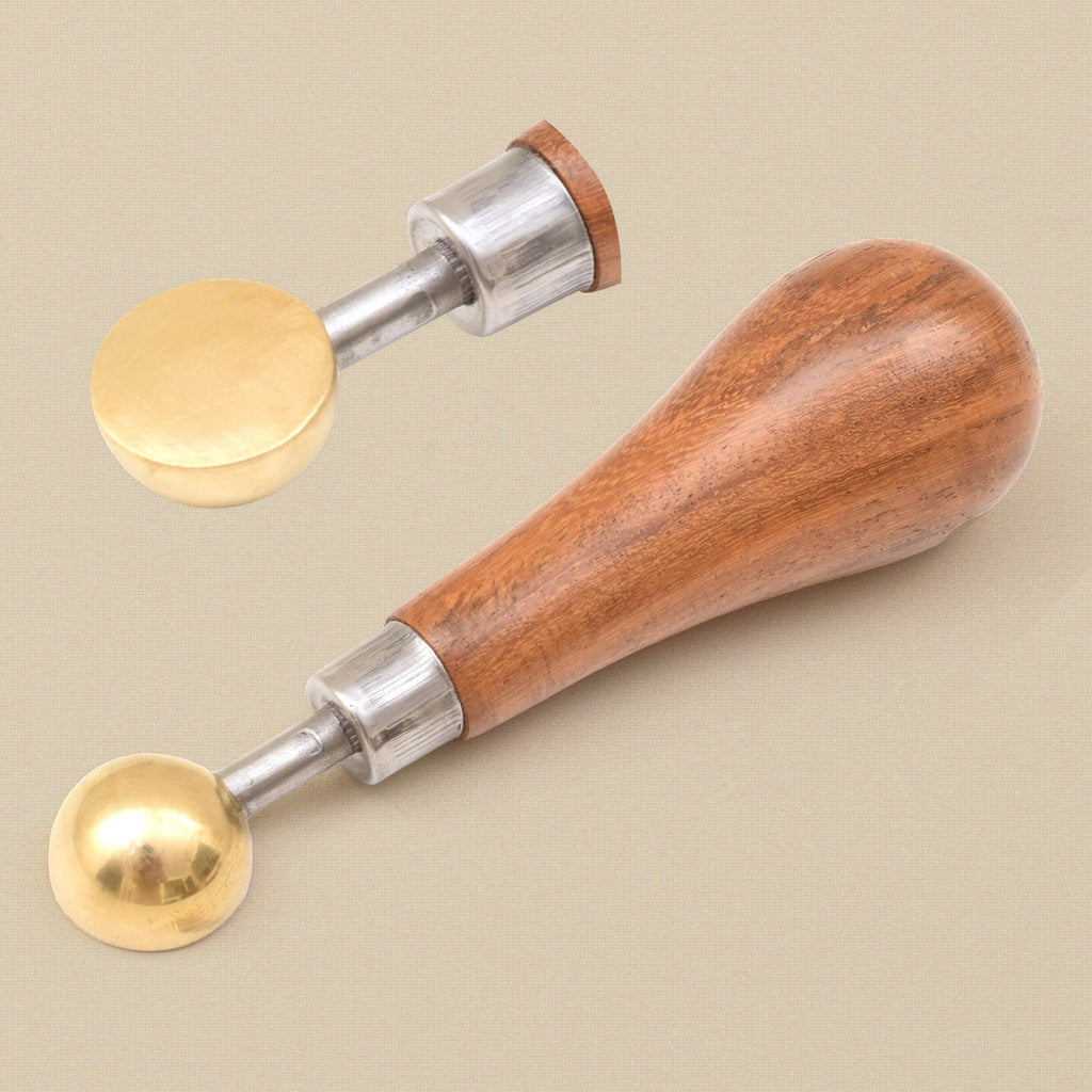 Brass bezel pusher with the head unscrewed from the handle