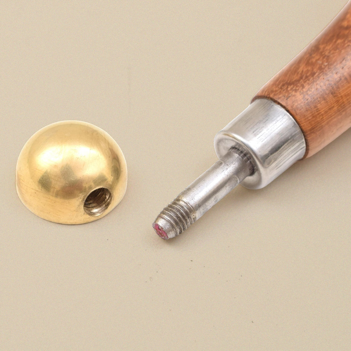 Brass head and threaded shank of the bezel pusher