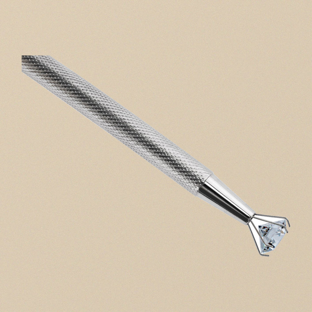 4-prong claw holder gripping a cut gemstone