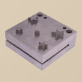 Five-pointed star disc cutter set showing the steel die block and five punches arranged neatly.