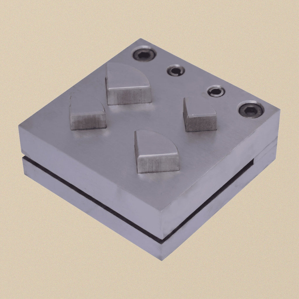 Carbon steel quarter circle disc cutter set with four punches and die block on a white background.