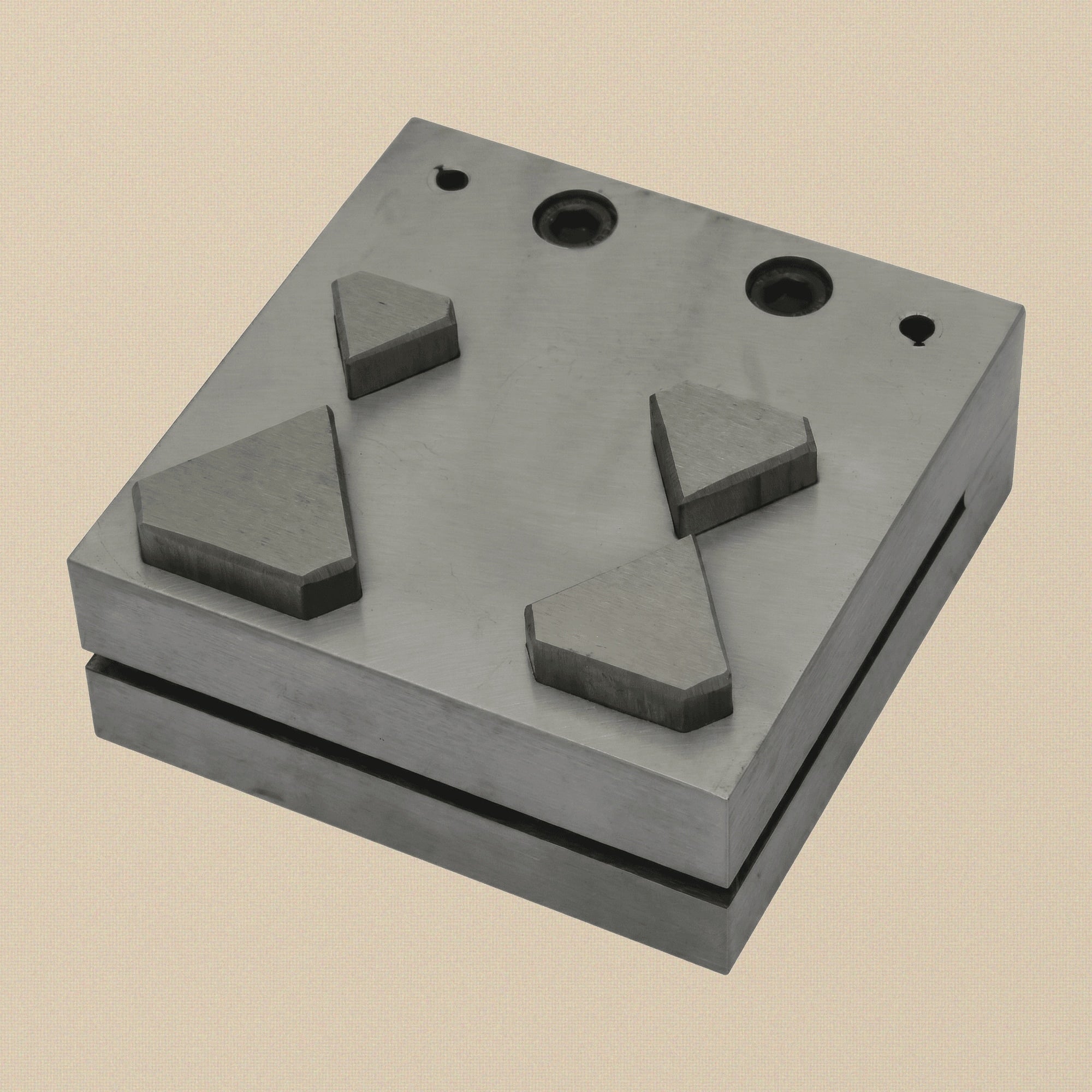 Hardened steel diamond disc cutter set with four punches arranged on a white background.