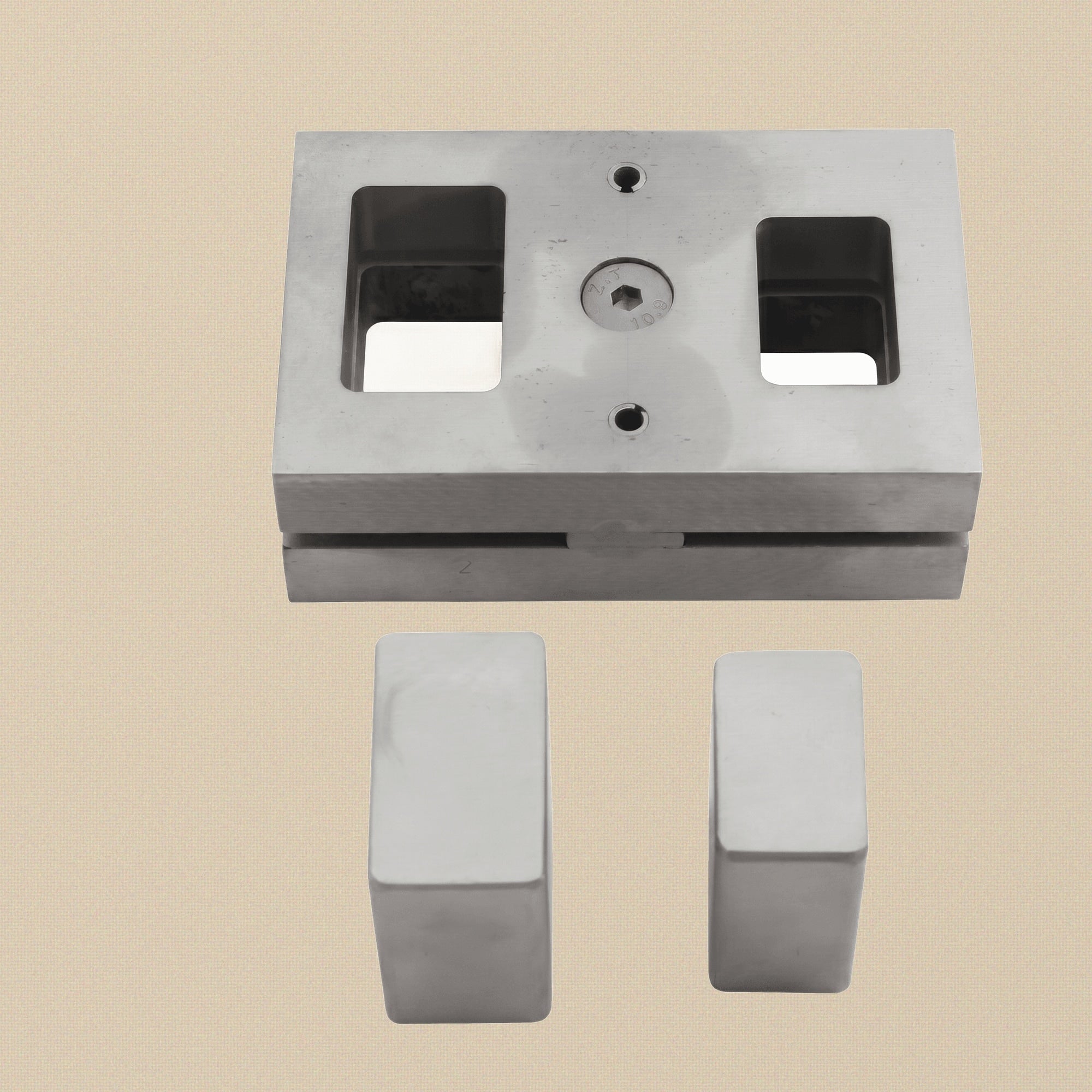 Top-down view of the rounded rectangle disc cutter die block showing the two punch slots.