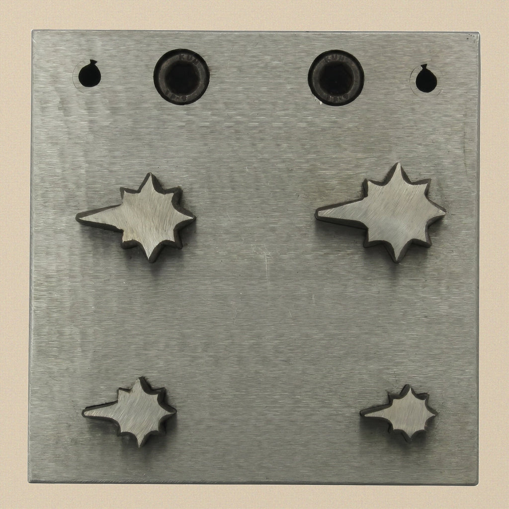 The four individual steel punches, showing the cutting edge and the hammered end.