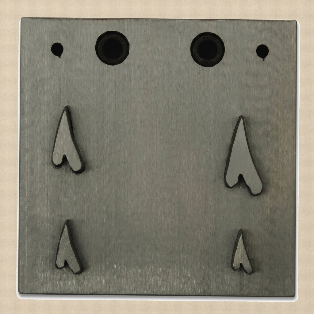 The four hardened steel punches for the narrow heart disc cutter set, showing cutting and striking ends.