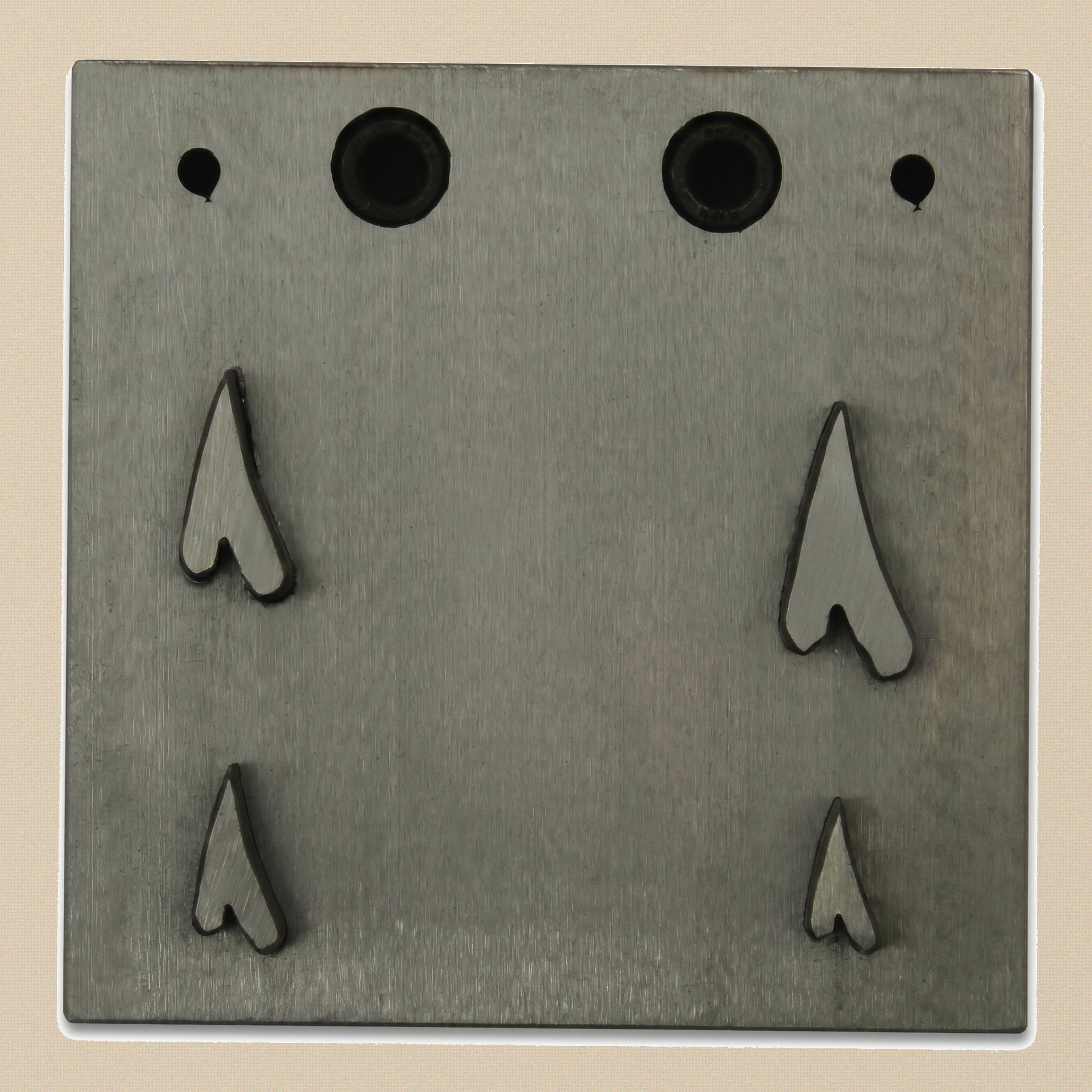 The four hardened steel punches for the narrow heart disc cutter set, showing cutting and striking ends.