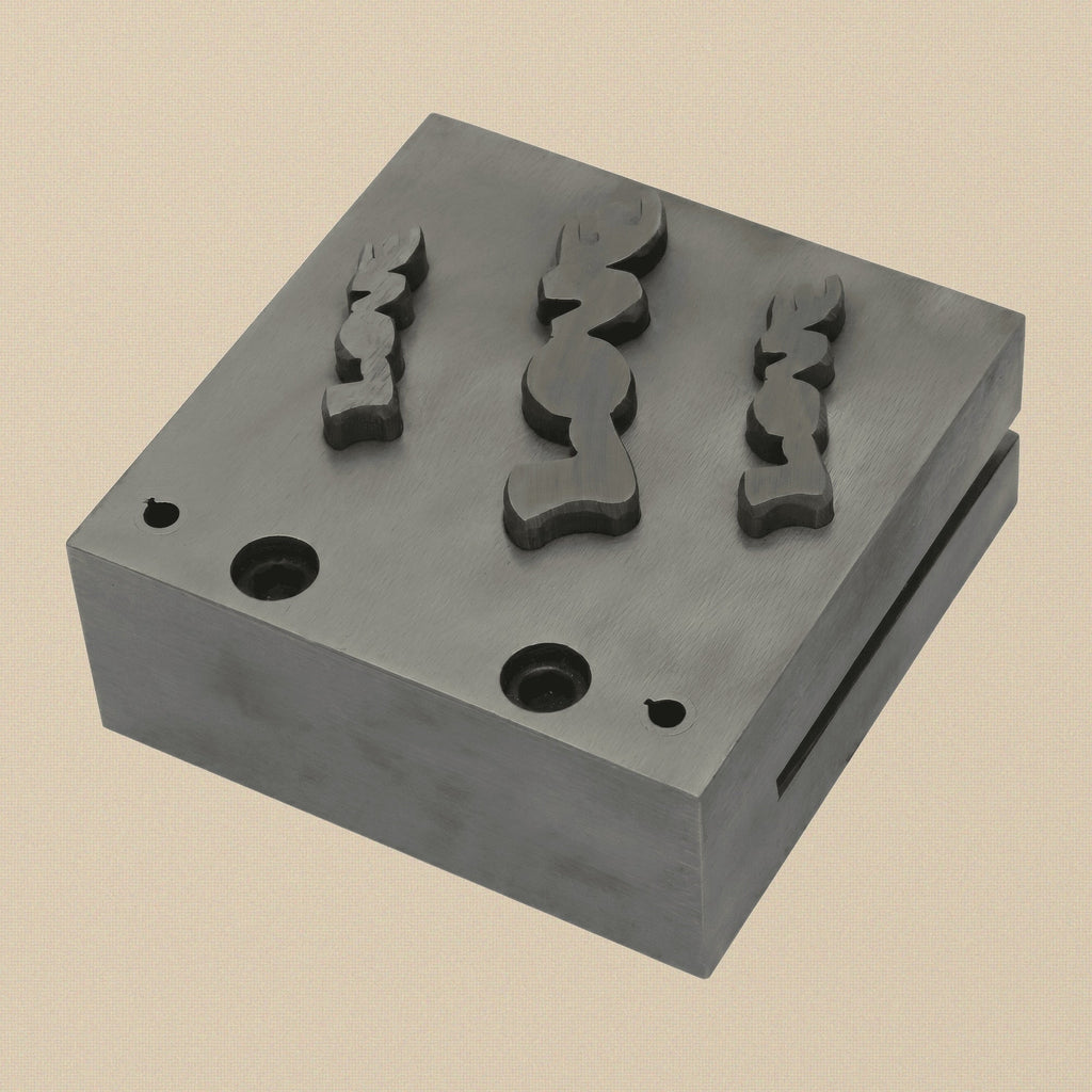 The three hardened steel punches for the LOVE word disc cutter set, showing striking and cutting ends.