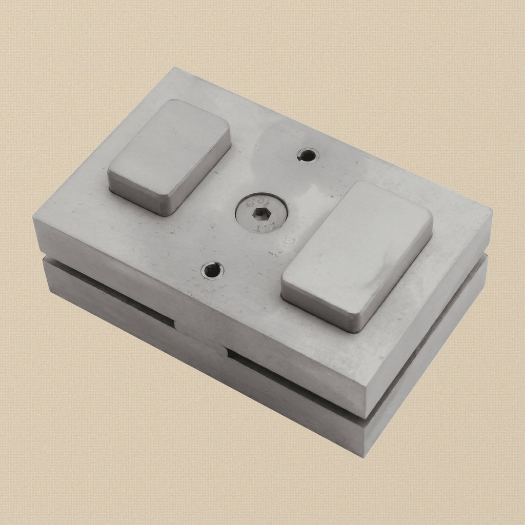 The two hardened steel punches for the rounded rectangle disc cutter, showing cutting and striking ends.
