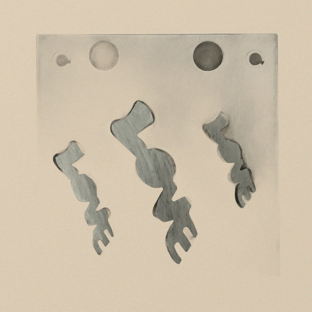 Side view of the LOVE word disc cutter block, showing its thickness and material finish.