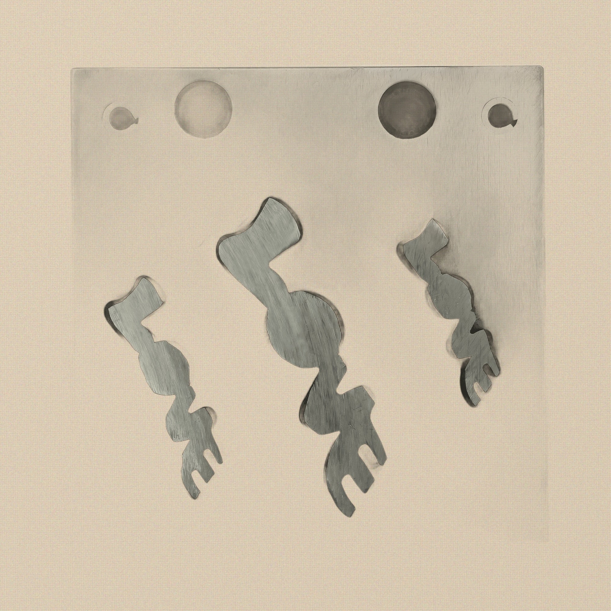 Side view of the LOVE word disc cutter block, showing its thickness and material finish.