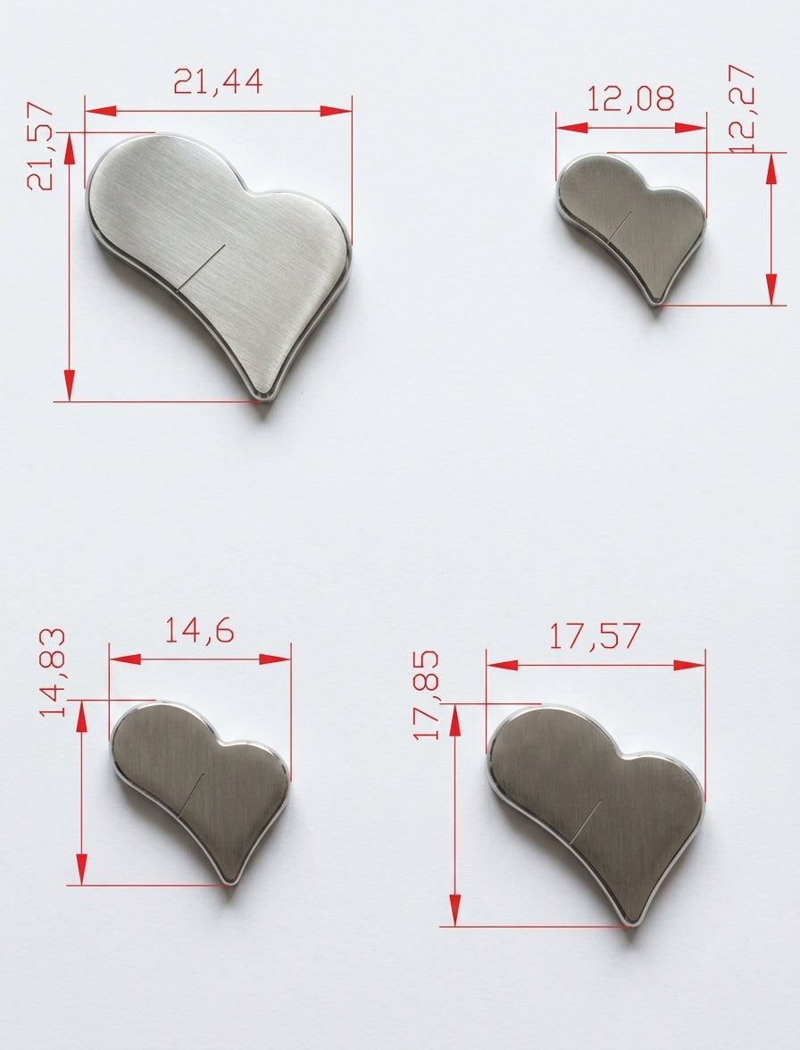 A single wide heart punch positioned over its corresponding hole in the cutter block.