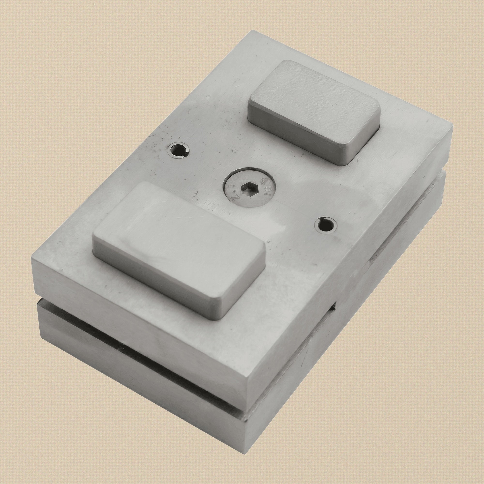 Close-up of the larger 25.4 x 42.85 mm punch slot on the steel die block.