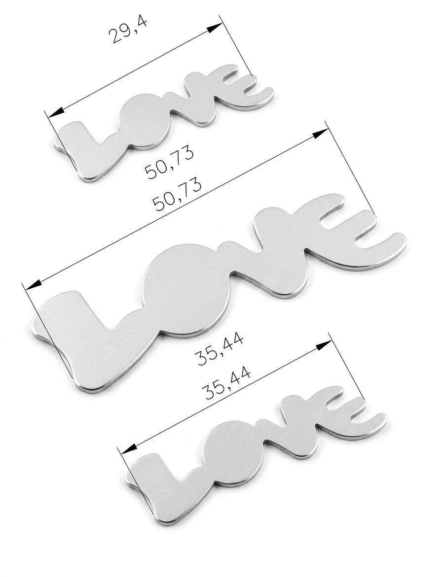 Close-up of one of the LOVE word shaped dies in the steel block.