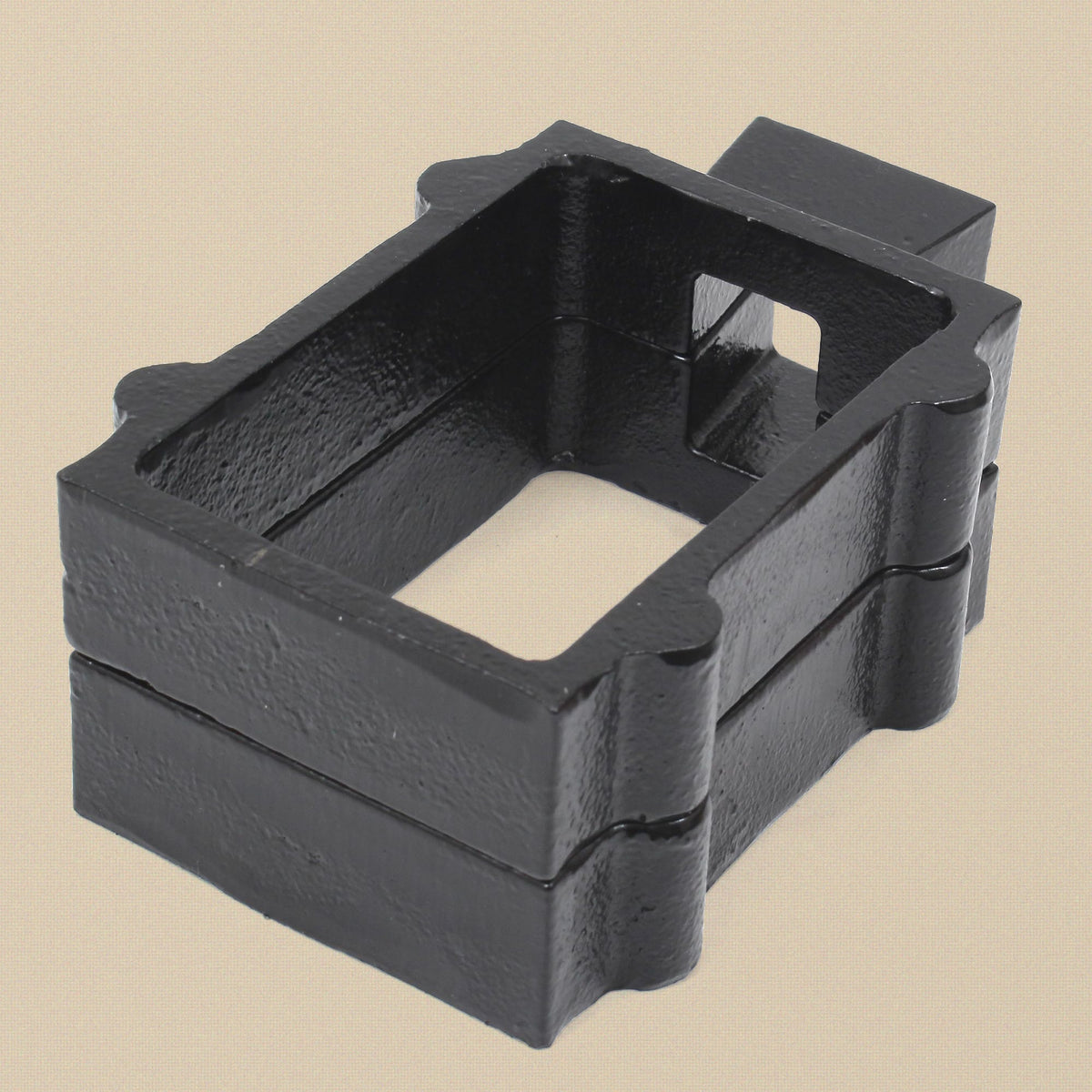Cast iron mould flask from the side showing the two halves and locating lugs