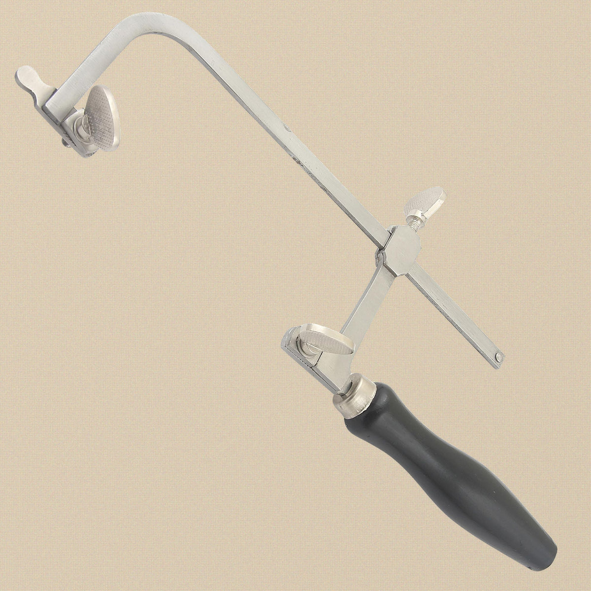 French style saw frame at an angle, showing the blade clamps