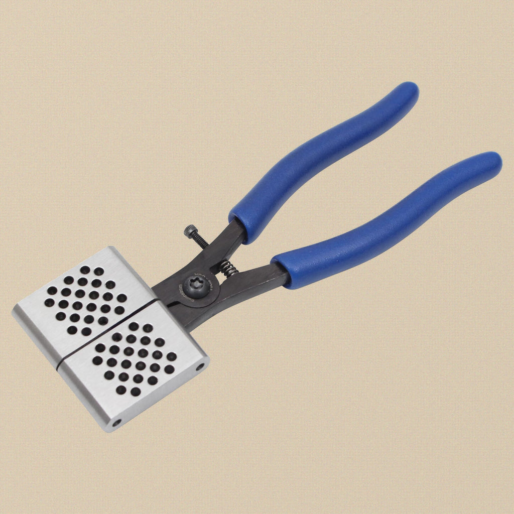 Link forming pliers showing the perforated jaw plate