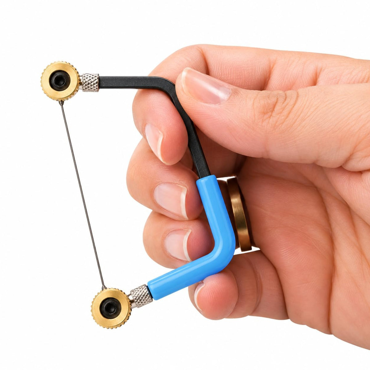 Miniature saw frame held in the hand with a blade fitted