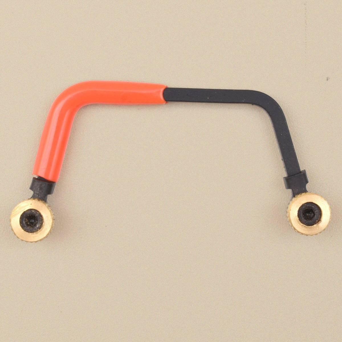 Miniature orange saw frame, fittings and thumb nuts laid out
