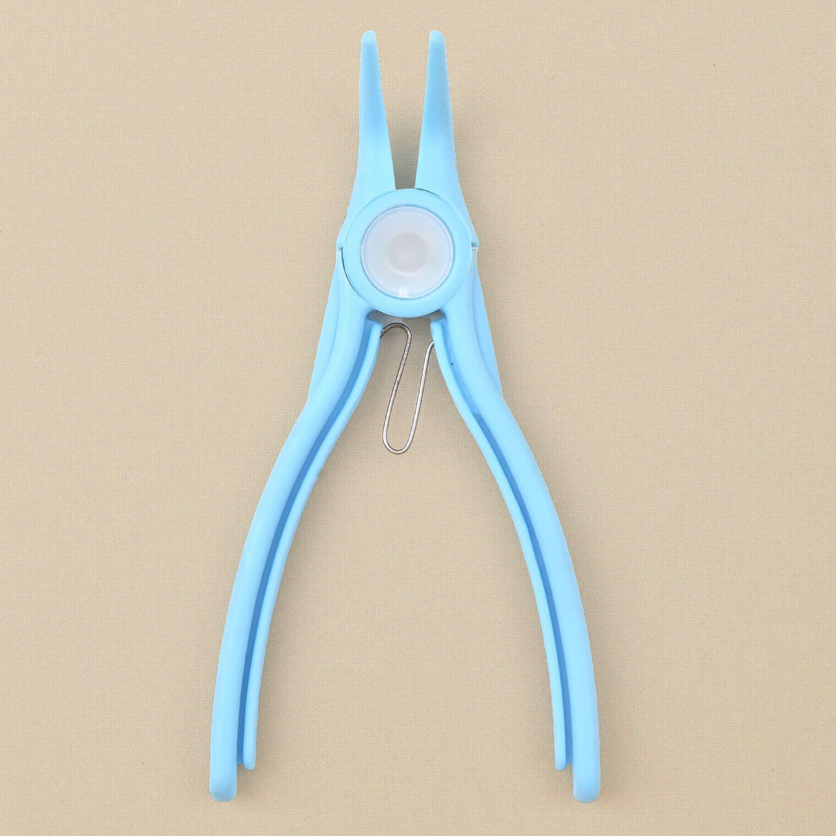 Light blue plastic bent chain nose pliers standing, jaws upward