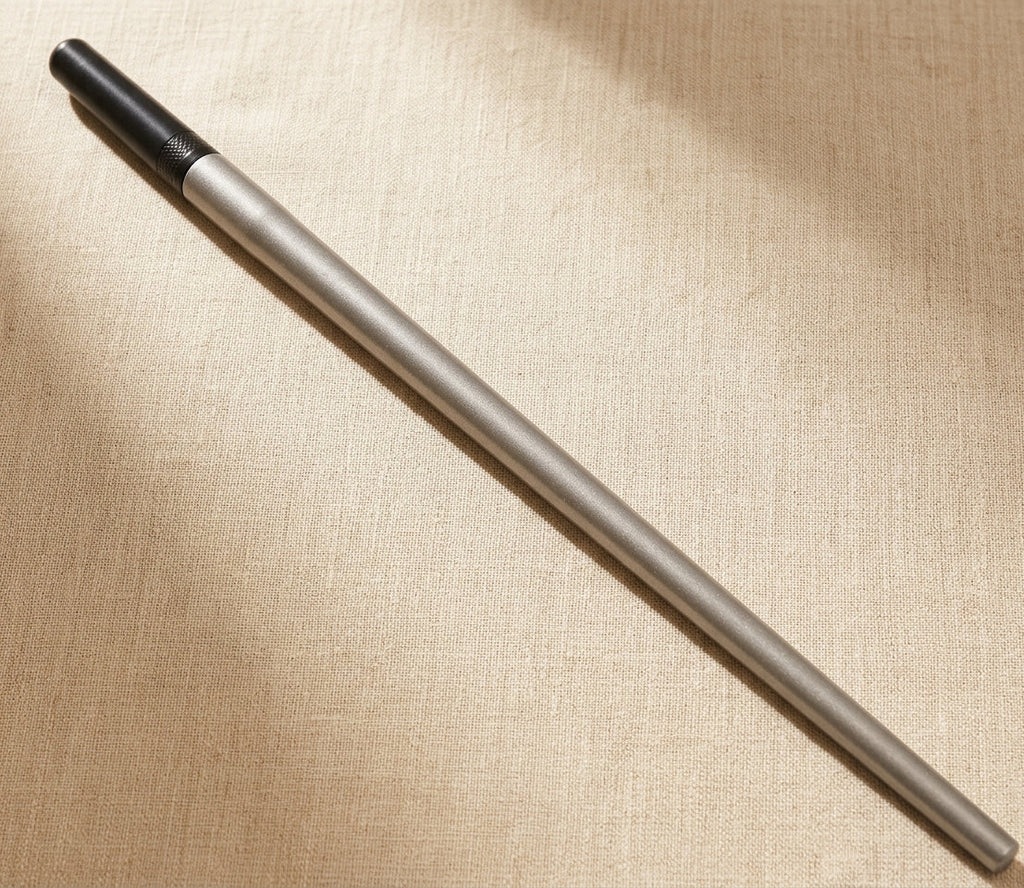 Close-up of steel ring sizing mandrel showing 3-10mm diameter markings