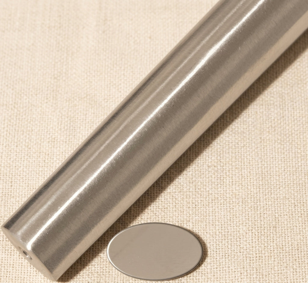 Close-up of solid steel oval ring shaping tool showing tapered mm dimensions