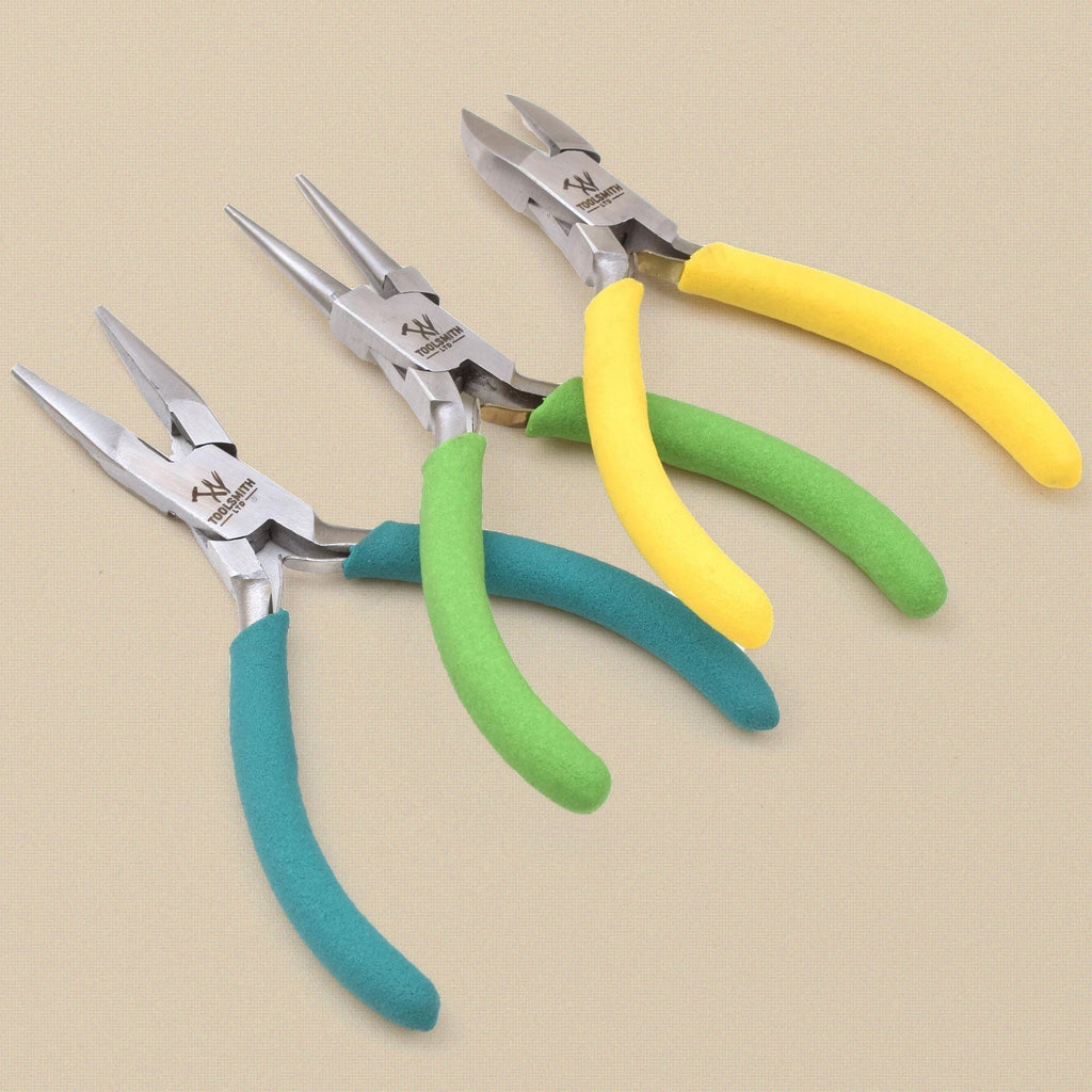 Three pliers fanned out, jaws to the front