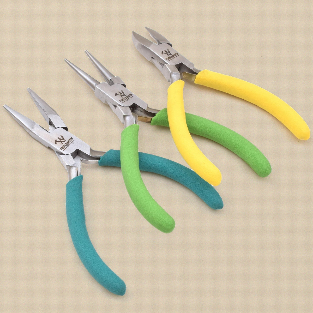 Three pliers fanned out, jaws to the front