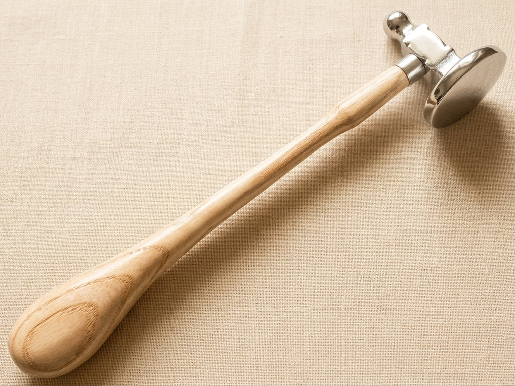 Close-up of the 45mm dome head of the jewellery chasing hammer, showing its polished finish