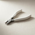 120mm diagonal cutters with white handles for jewellery wire work.