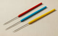 3-piece set of titanium tip soldering picks for jewellery making, non-stick, in red, blue and yellow.
