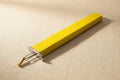 Yellow jewellery knotting tool for consistent knots with beads