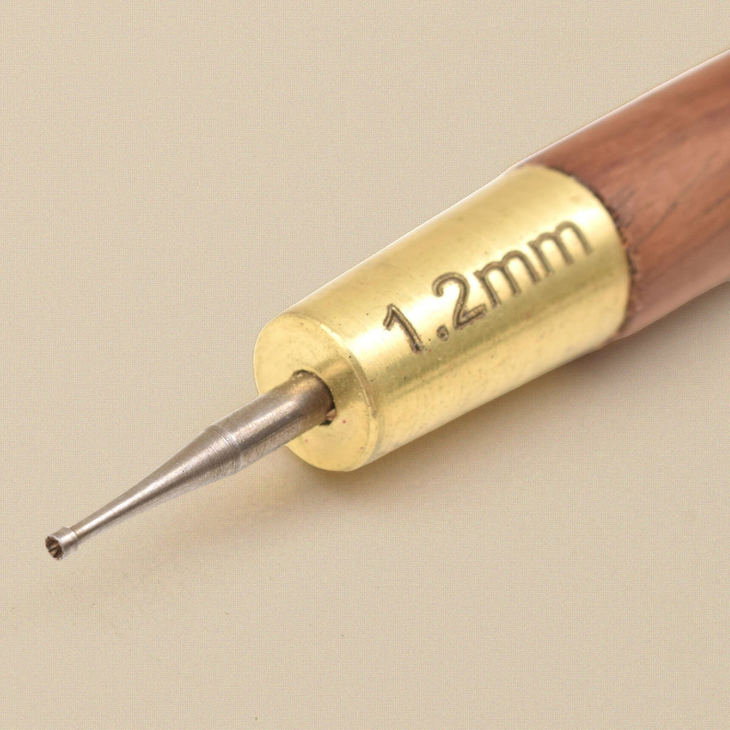 Close-up of the 1.2 mm cup bur and brass ferrule