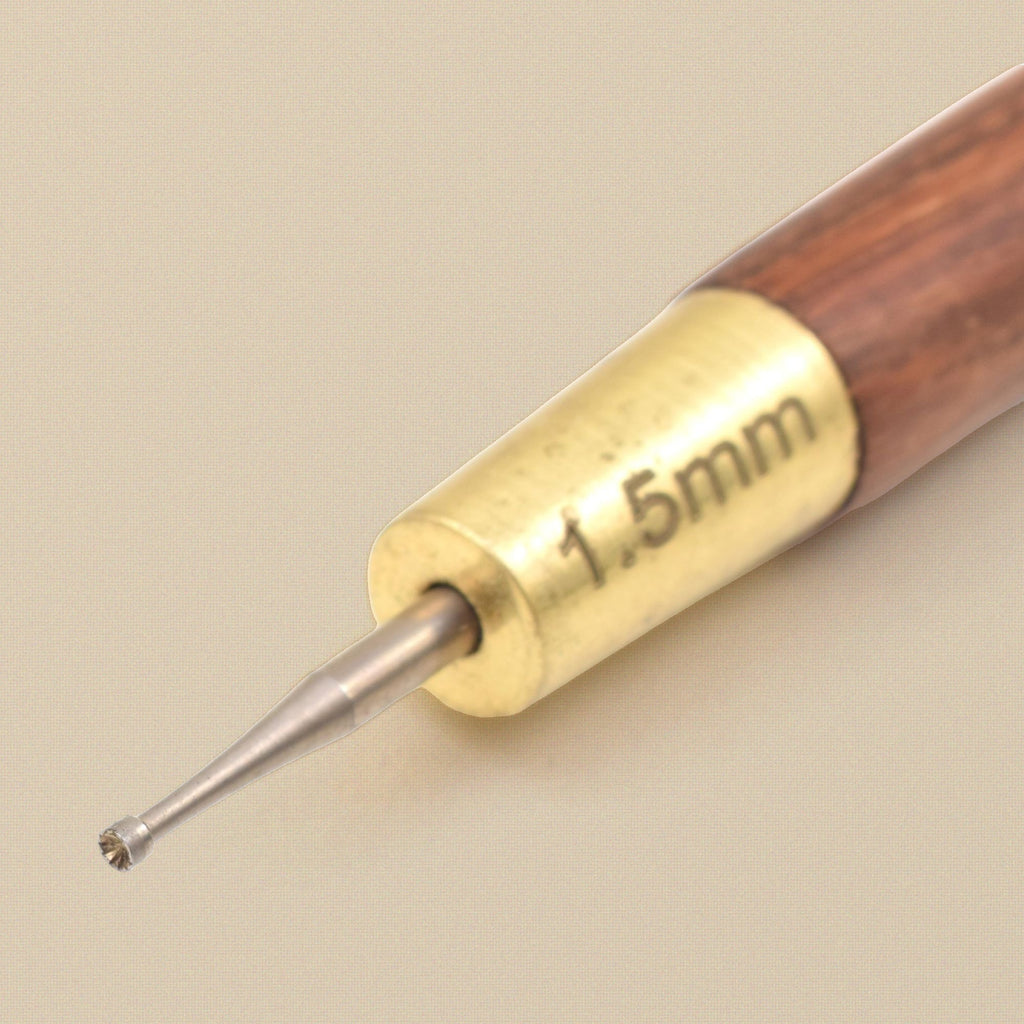 Close-up of the 1.5 mm cup bur and brass ferrule