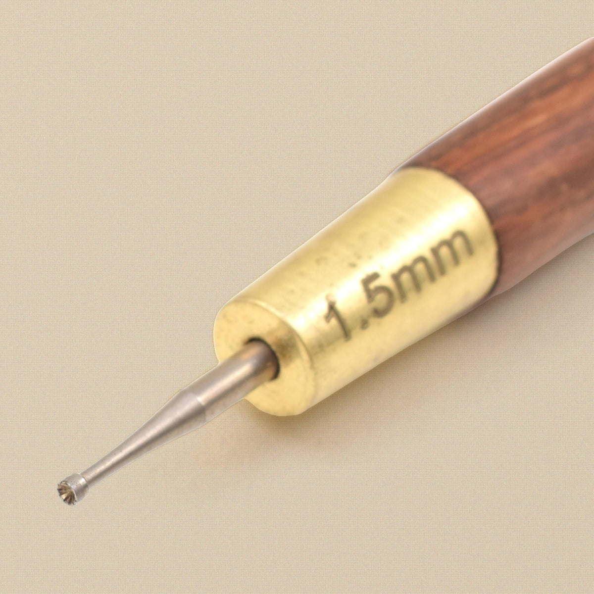 Close-up of the 1.5 mm cup bur and brass ferrule