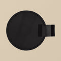 Black leather sand bag, 12 inch round, unfilled, seen from above