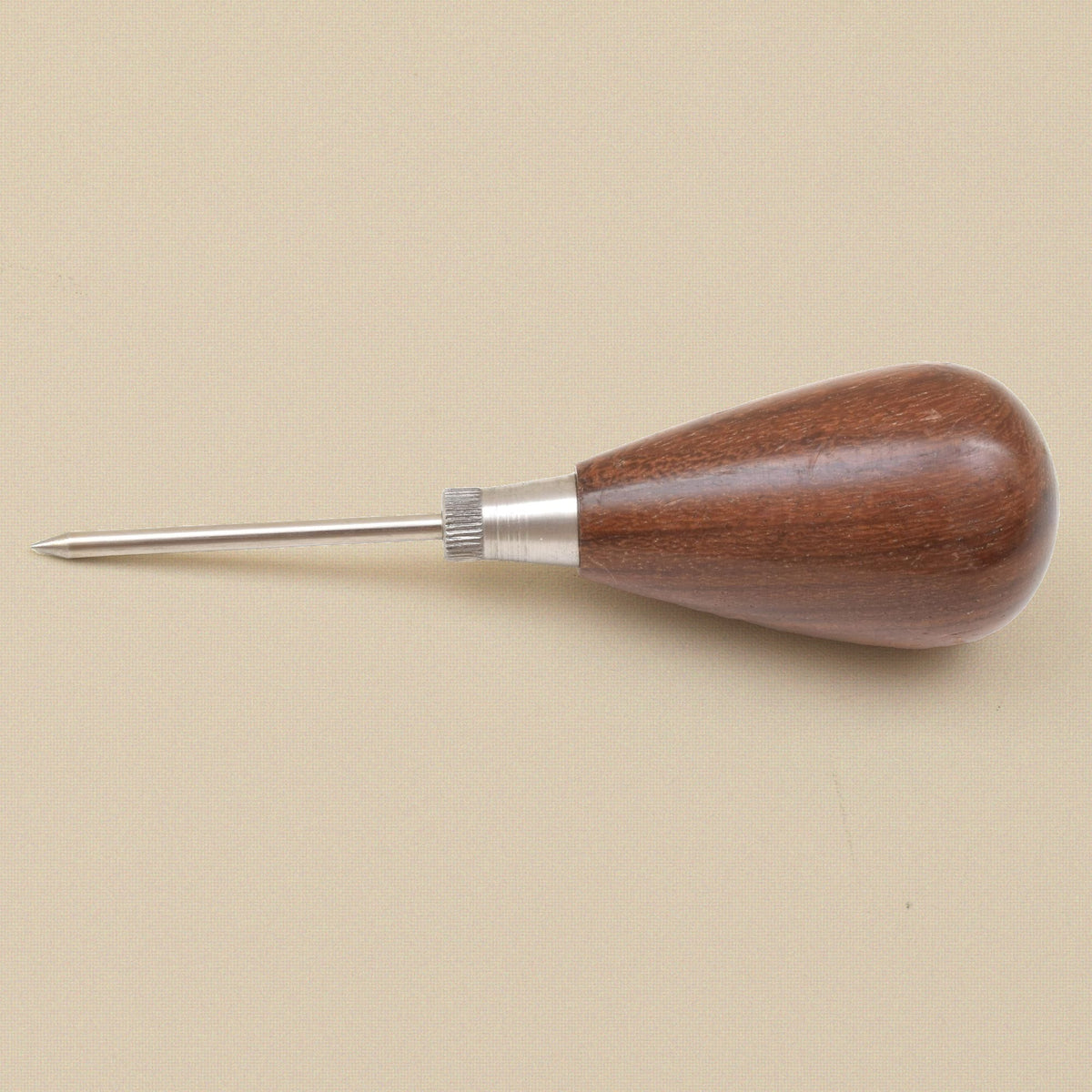 Scratch awl lying flat, point to the left
