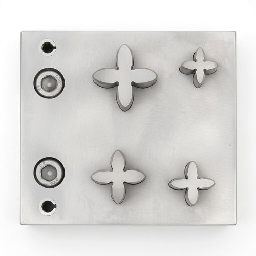 Close-up of the four petal steel disc cutter with its sharp cutting edge for jewellery making.