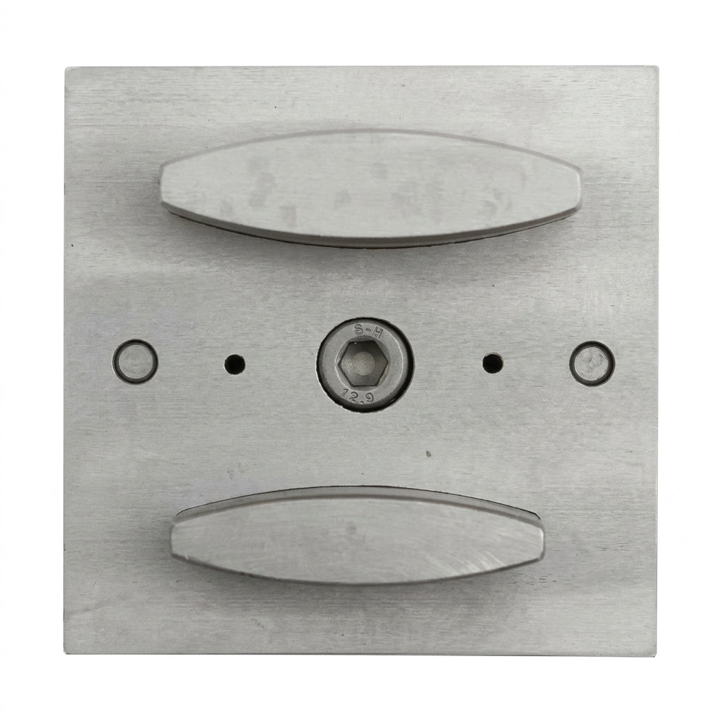 Close-up of the narrow oval punch shapes of the steel disc cutter.