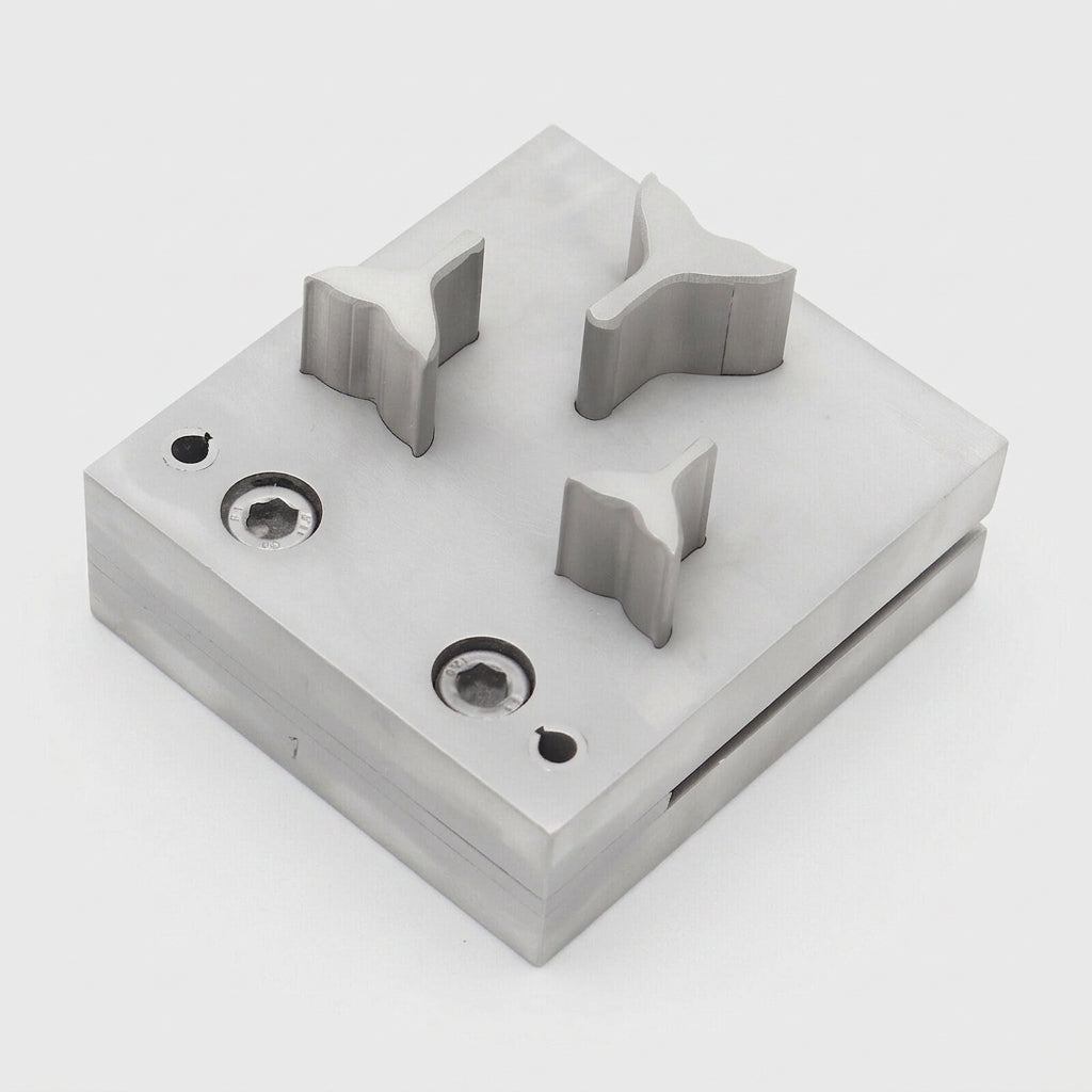 Close-up of the three steel disc cutter sizes, showing their polished finish and parallel action.