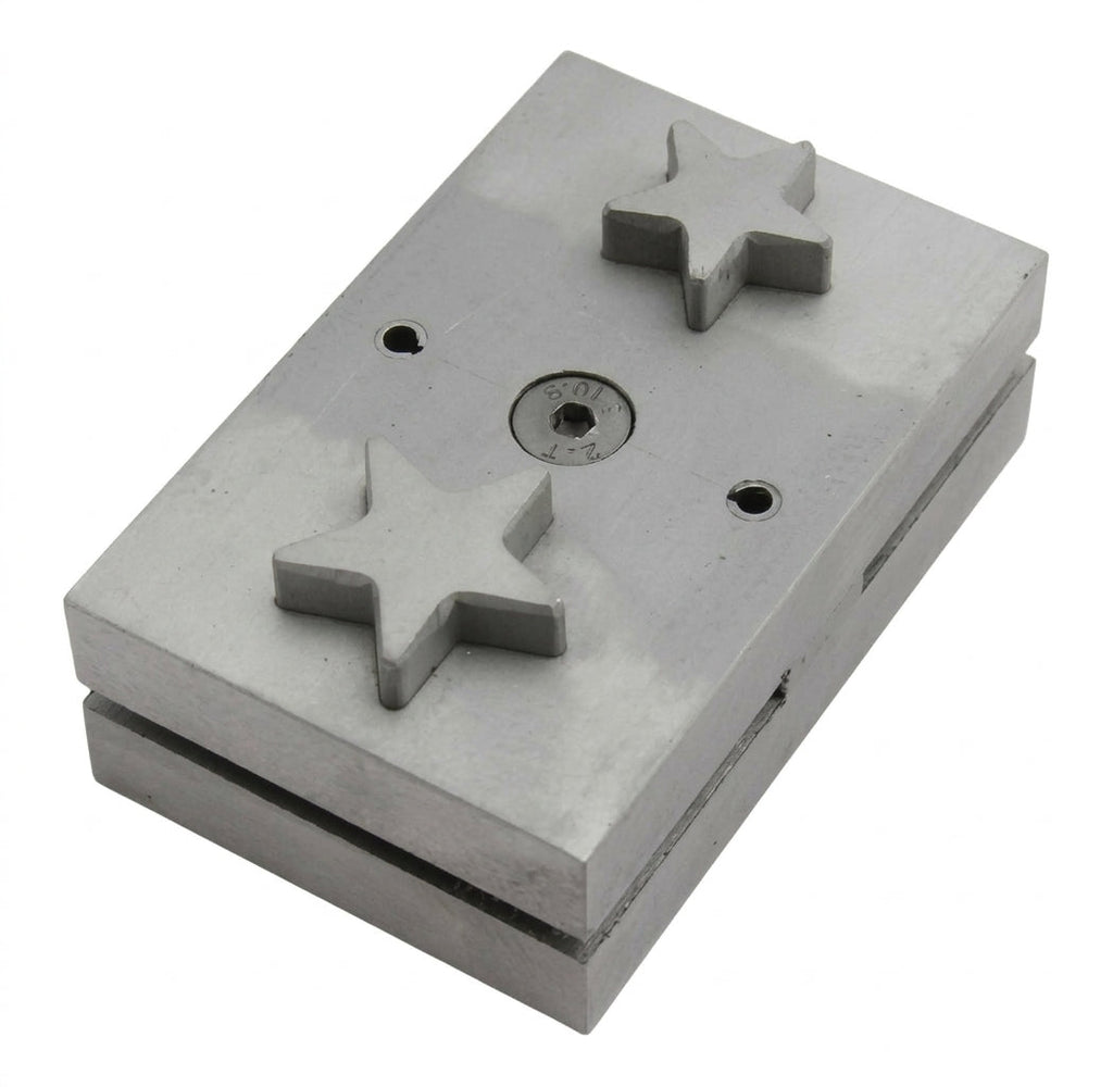 Close-up of the star-shaped punch die for cutting metal sheet jewellery discs.