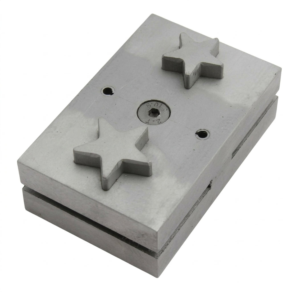 Close-up of the star-shaped punch die for cutting metal sheet jewellery discs.